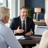 Licensed Medicare Advantage broker consulting with senior clients about Medicare plan options